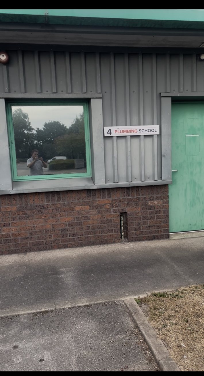 Unit 4 Plumbing School entrance sign in Deeside